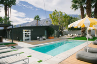 Full king bed in a fully furnished bedroom. 
| The Electric Lady by Boutiq Luxury Vacation Rentals | Palm Springs, California