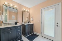 The primary bath  features a walk in shower and a large bathtub perfect for cleaning off after a day on the beach!
| White Sands by Boutiq Luxury Vacation Rentals | Destin, Florida