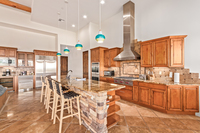 Cooking for a large group is a breeze with the six-burner, Wolf gas stove-top. The dining and kitchen spaces are close enough to make meals a breeze but spacious enough for guests to enjoy separately.
| The Sonoran by Boutiq Luxury Vacation Rentals | Scot